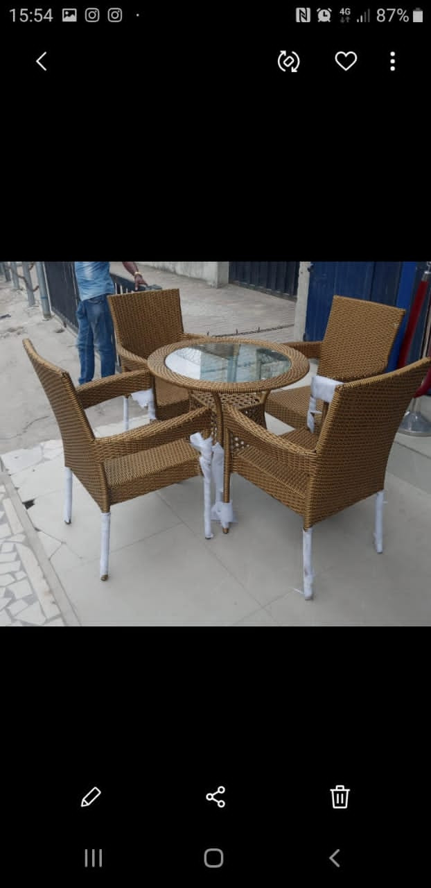 Outdoor restaurant chairs with glass top table